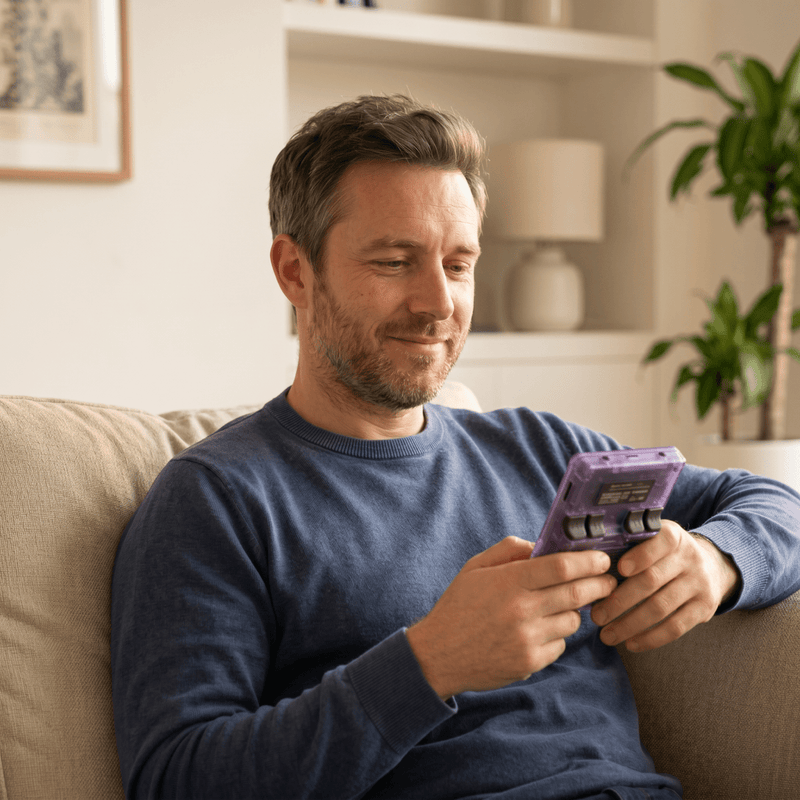 Person playing the Vibeourplus Pro 2.0 R36S retro gaming console at home