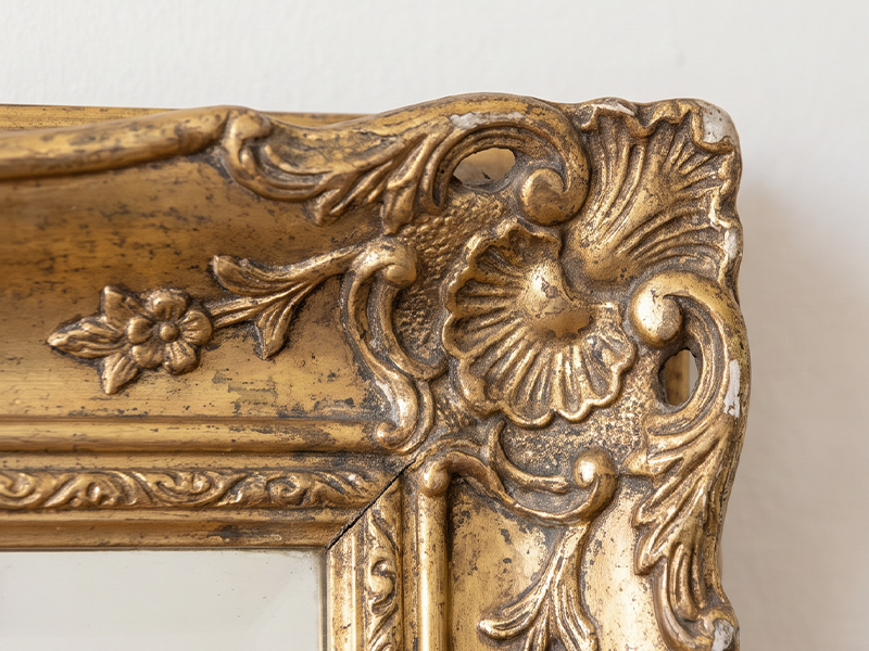 Worn decorative detail before touch-up